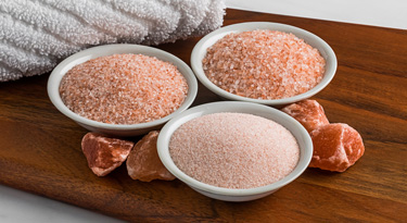 Ancient Ocean® Himalayan pink bath salt crystals in bowls
