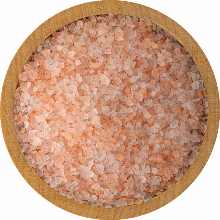 Pink Himalayan salt in a wooden bowl on a white background