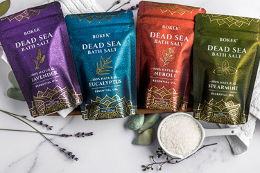 A row of 8 oz Bokek® Scented Dead Sea Salt pouches