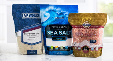 Small bulk bags of Breton® Sel Gris, Pure Ocean®, and Ancient Ocean® on a counter
